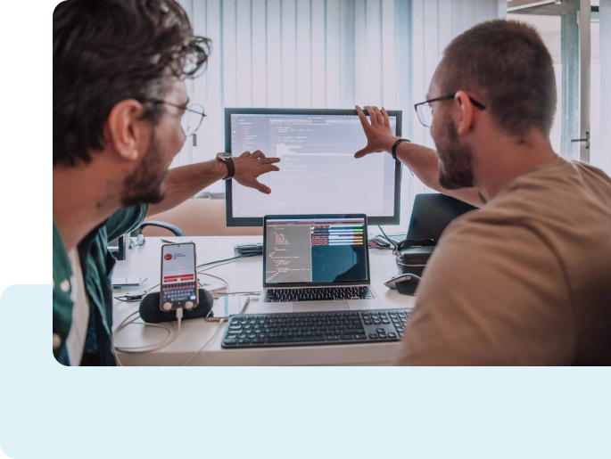 Two engineers looking at FieldLogs screen
